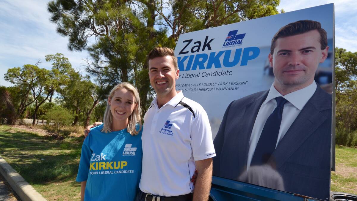 Final countdown: Zak Kirkup, with his fiance Michelle Gadellaa, makes his last minute pitch to voters at pre-polling in Greenfields on Tuesday. Photo: Nathan Hondros.