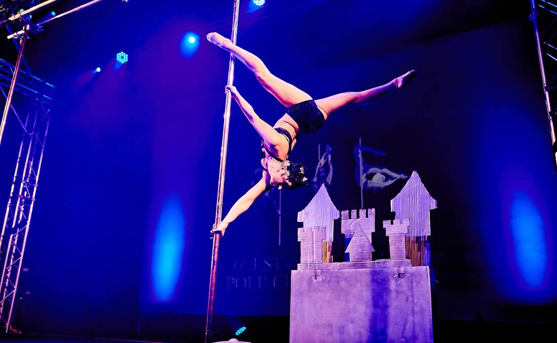 Amazing: Anna takes to the pole to impress with her strength and skill as she performs circus-like feats suspended in the air. Photo by Nina Otranto.