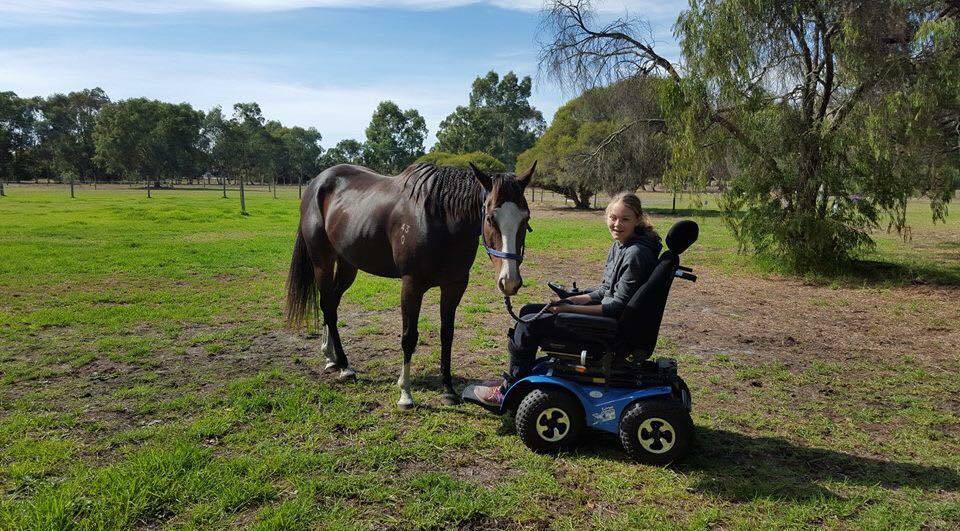 Life improvment: Sophie has already trialed the mobility chair and her Mum said it's improved her ability to interact with her horses.