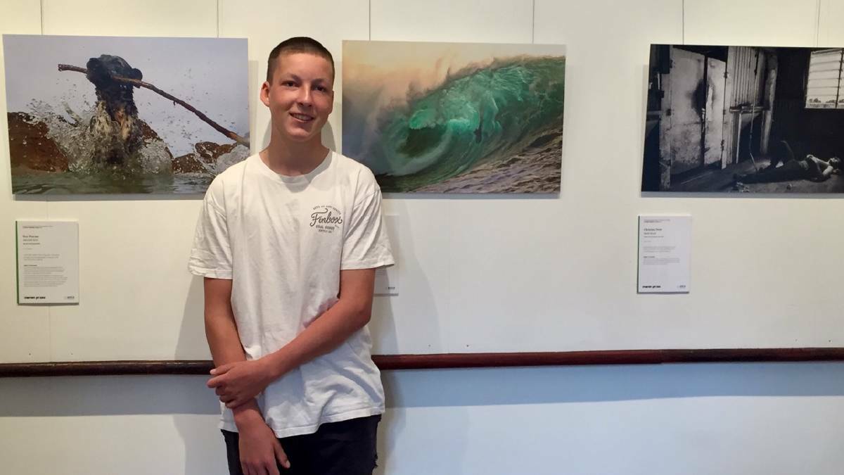 Lachy Starling with his award winning image 'Forces' of body-boarder 'madman' Shane Ackerman. Picture: Supplied