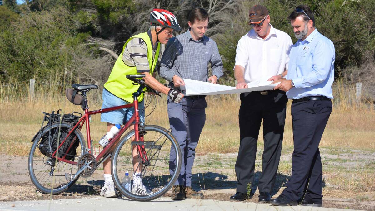 Peter Eckersley, Kyle Daly, Alan Cross and Jason Gick looking at plans for the shared path.