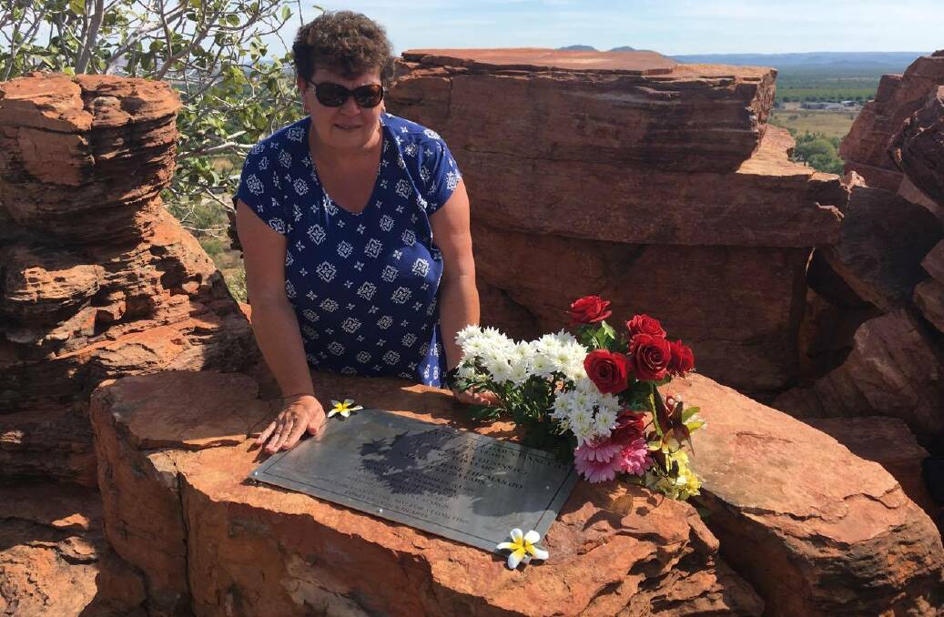 Carolyn Cousins visiting the plaque dedicated to Jessica, Whitney and Sarah, the Kimberley Stars, at Kelly's Knob. 