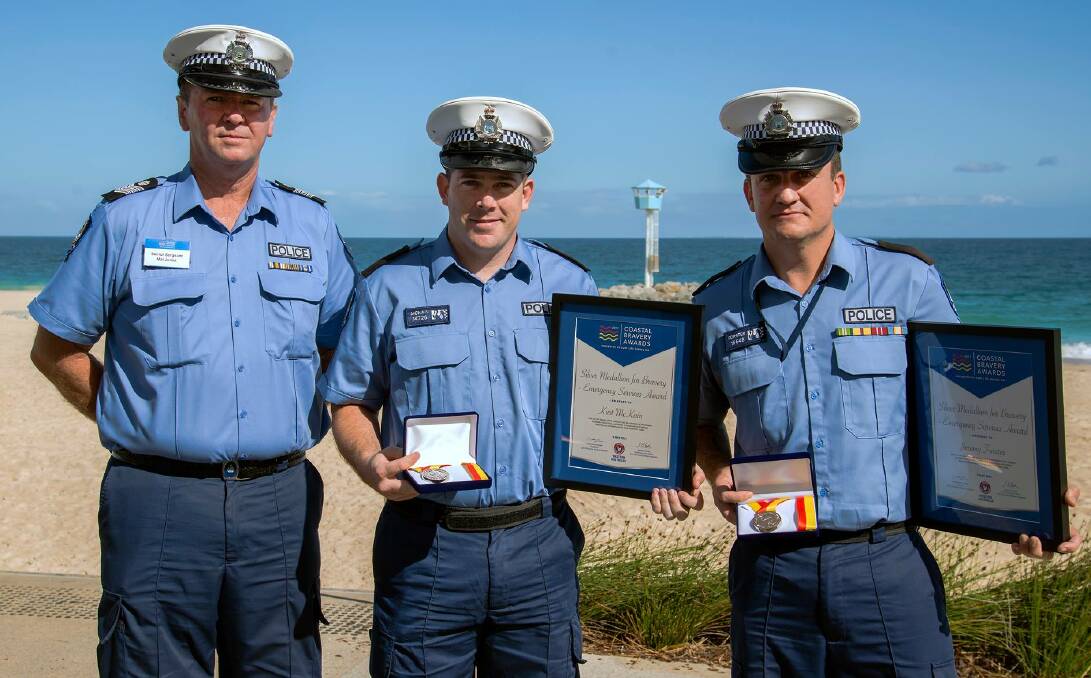 Bunbury Police officer-in-charge Senior Sergeant Mal Jones with constables Kurt McKain and Jeremy Forster who were presented coastal bravery award silver medallions on Friday.