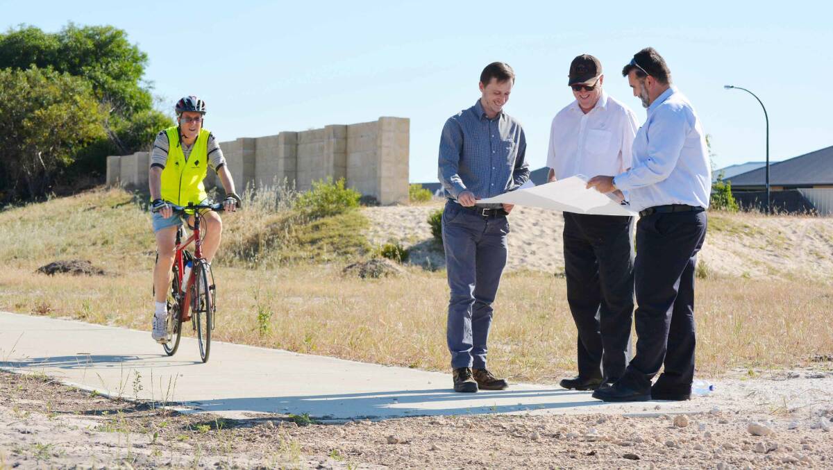 Kyle Daly, Alan Cross and Jason Gick take a look at plans for the shared path as they are approached by Peter Eckersley.