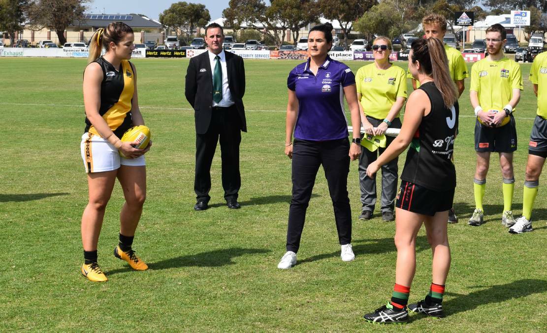Fremantle Dockers women’s coach Michelle Cowan will be a guest presenter at Rando & Associates’ fourth annual women’s health and wellness day at the Sanctuary Golf Club. Here she is pictured tossing the coin at the recent 2017 SWFL women's grand final. 