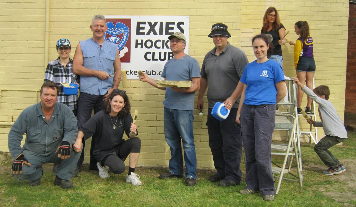 Alcoa employees and Exies Hockey Club committee members repaint the club. Pictured are Matt Peters, Kylie Marino, Adele Peters, Alan Douglas, Bruce Greathead, Jason Shaw and Anita Loguidice. 