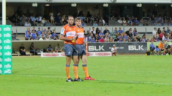 Career move: Bunbury City Bulls player Anro Habig has won an ARU scholarship and hopes to become a top-class referee. He is pictured helping an international referee at a recent Super Rugby match in Perth.