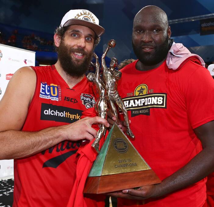 Australia's best: Matt Knight and Nate Jawai of the Wildcats pose with the trophy after winning the 2015 NBL Championship trophy. Photo: Paul Kane/Getty Images.