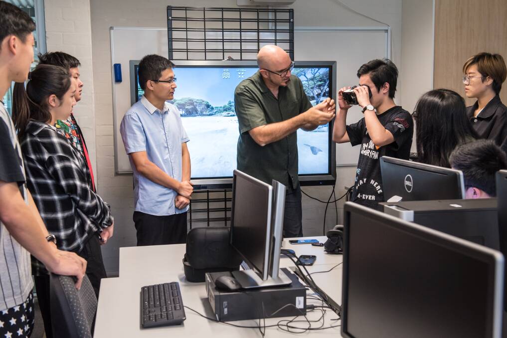 South Regional TAFE lecturer Mike Dunn inspired the Chinese Digital Animation Masterclass by providing an insight into the creation of virtual reality videos assisted by interpreter Yan Lyu from the Bunbury-Jiaxing Business Office. Photo: Fran Jackson.