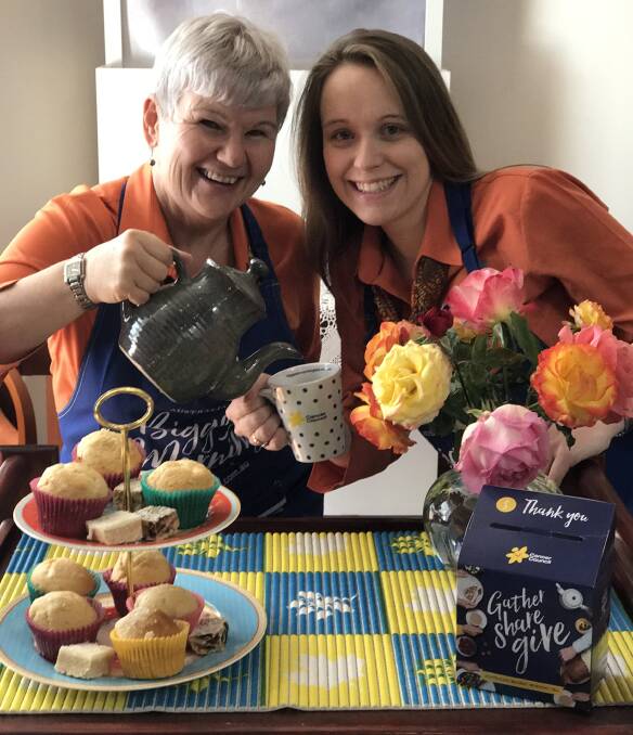 William Barrett and Sons staff members Joscelyn Jones and Melody Hibberd are busy transforming their workplace into a makeshift cafe for a cause this Thursday.