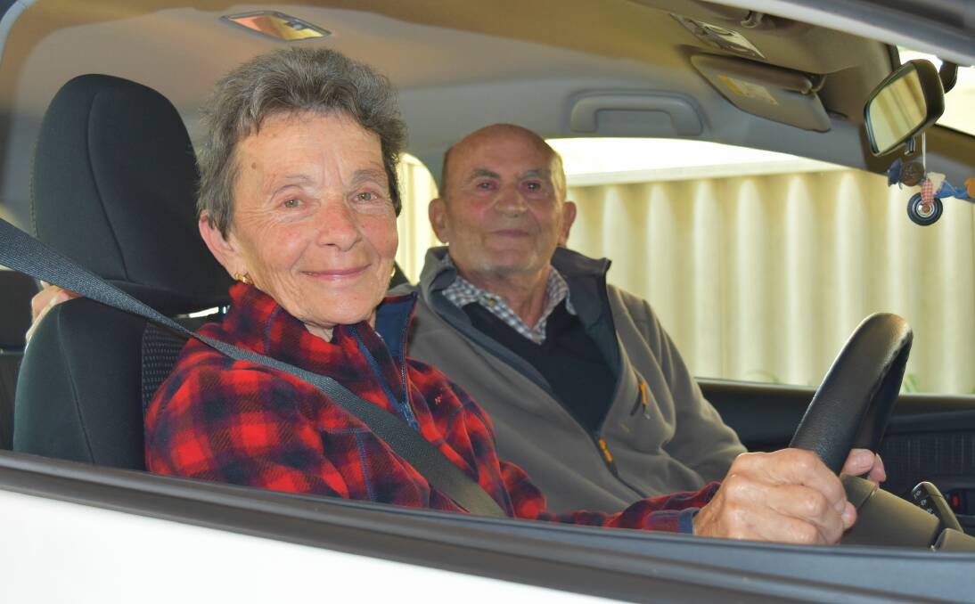 Behind the wheel: Pelican Point resident Lucy Coppo-Andreone was extremely proud to pass her driving test for the first time aged 74 last week. She is pictured ready to take a spin with her proud husband Remo. 