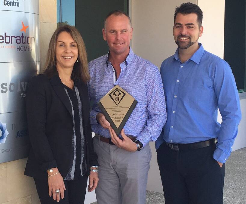 Dale Alcock Homes South West customer service manager Simone Nani, general manager Steve Hancock and sales manager Ben Beven with their HIA WA award.