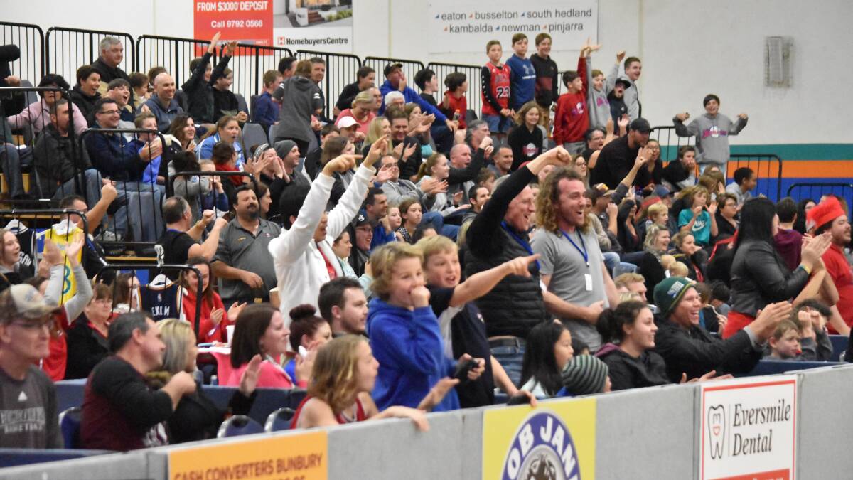 The crowd at Eaton Recreation Centre celebrate Tre Nichol's buzzer beating three point shot. Photo: Andrew Elstermann.