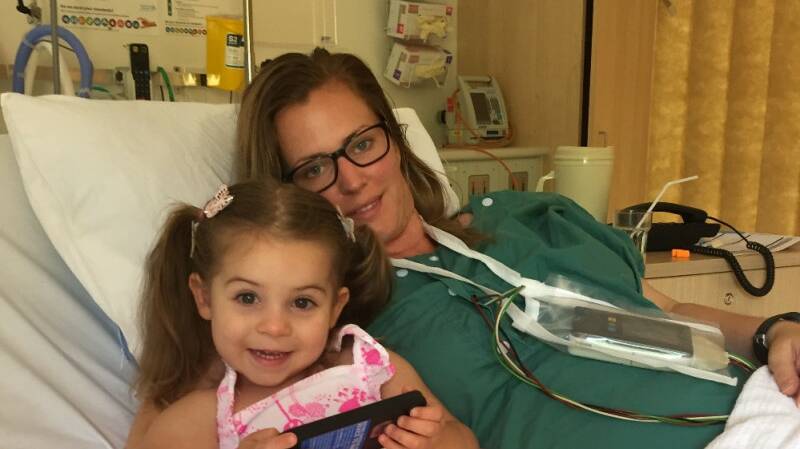 Millbridge mother Felicity McQueen was diagnosed with atrial fibrillation after noticing a regularly high heart rate on her Fitbit. She is pictured with her daughter Olivia.