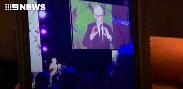 Malcolm Turnbull mimics the US President at the Midwinter Ball in Canberra. Photo: 9news.com.au
