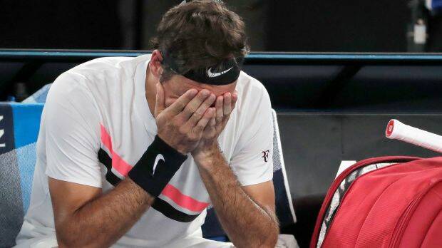 Federer has a moment to himself amid the enormity of his achievement. Photo: AP
