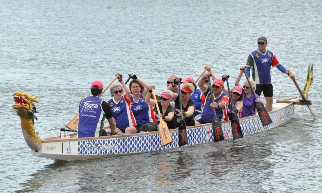 Having a go: Forza Dragon Boat Club's open day participants steered and propelled the vessel around Leschenault inlet on Sunday morning. Photo: Thomas Munday. 