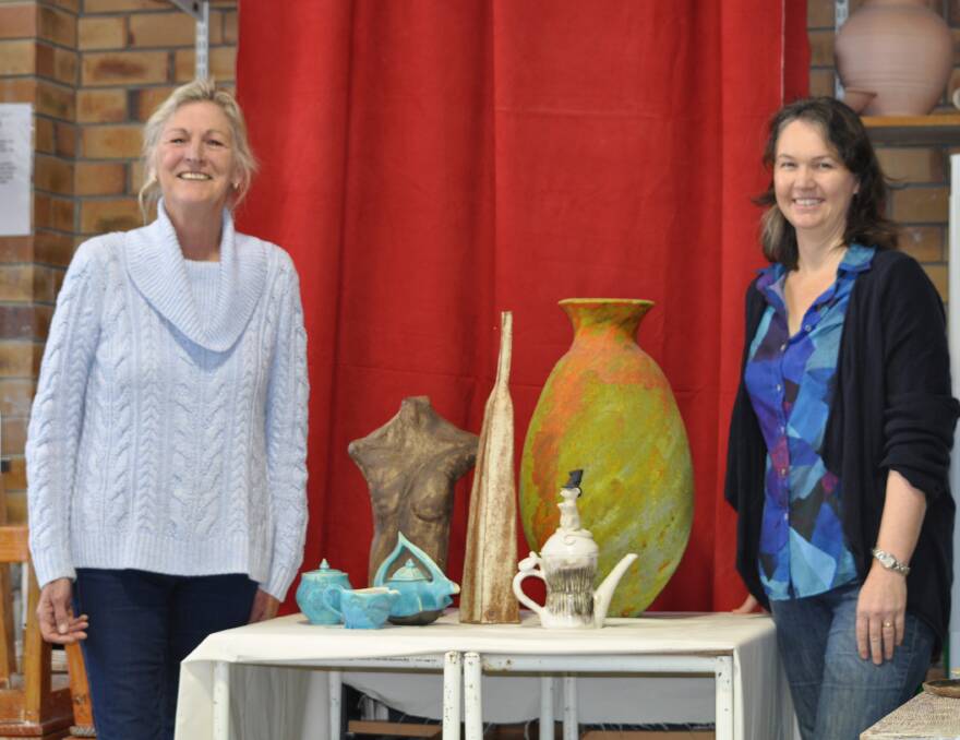Artist's touch: Wendy Sullivan and Jessica Stegena of the Bunbury Studio Potters. The group's exhibition begins on Friday evening. Photo: Thomas Munday. 