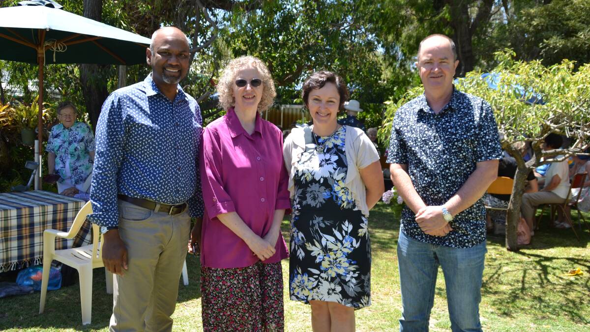 Happy together: YouthCARE's Stanley Jeyaraj, Susan Moore, Cathryn Cox and David Cunniffe enjoying the garden party. Photo: Thomas Munday. 