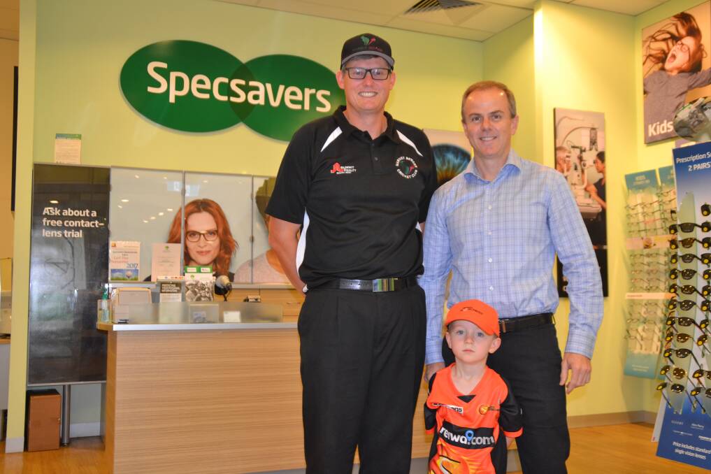 For the love of the game: Cricket fan Haydn Jones celebrating alongside Specsavers Eaton Fair owner Mark Lloyd and his son Angus Lloyd. Photo: Thomas Munday. 