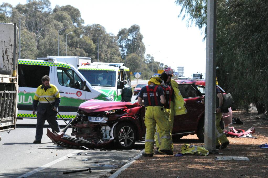 South West Police, Bunbury Fire and Rescue Services and St John Ambulance Services investigate Robertson Drive crash. Photo: Thomas Munday. 