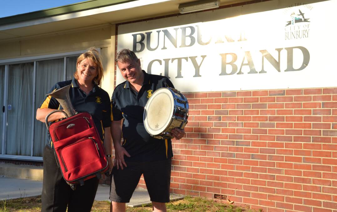 March to the beat: Bunbury City Band secretary Sue Veitch and percussionist Nathan Wheals ready to raise funds for the goup's upcoming trip to Vietnam. Photo: Supplied. 