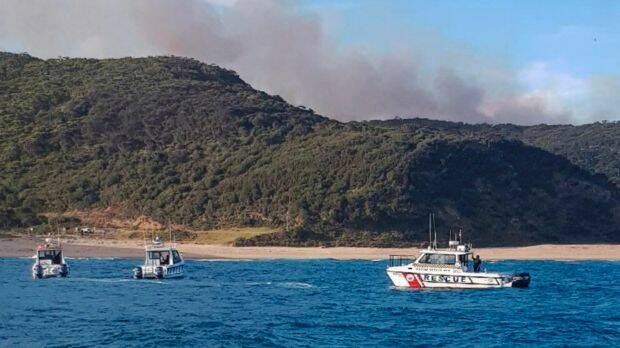 Boats from Marine Rescue NSW, NSW Police, NSW Maritime and Surf Life Saving NSW evacuated up to 80 people from the Royal National Park. Photo: Supplied