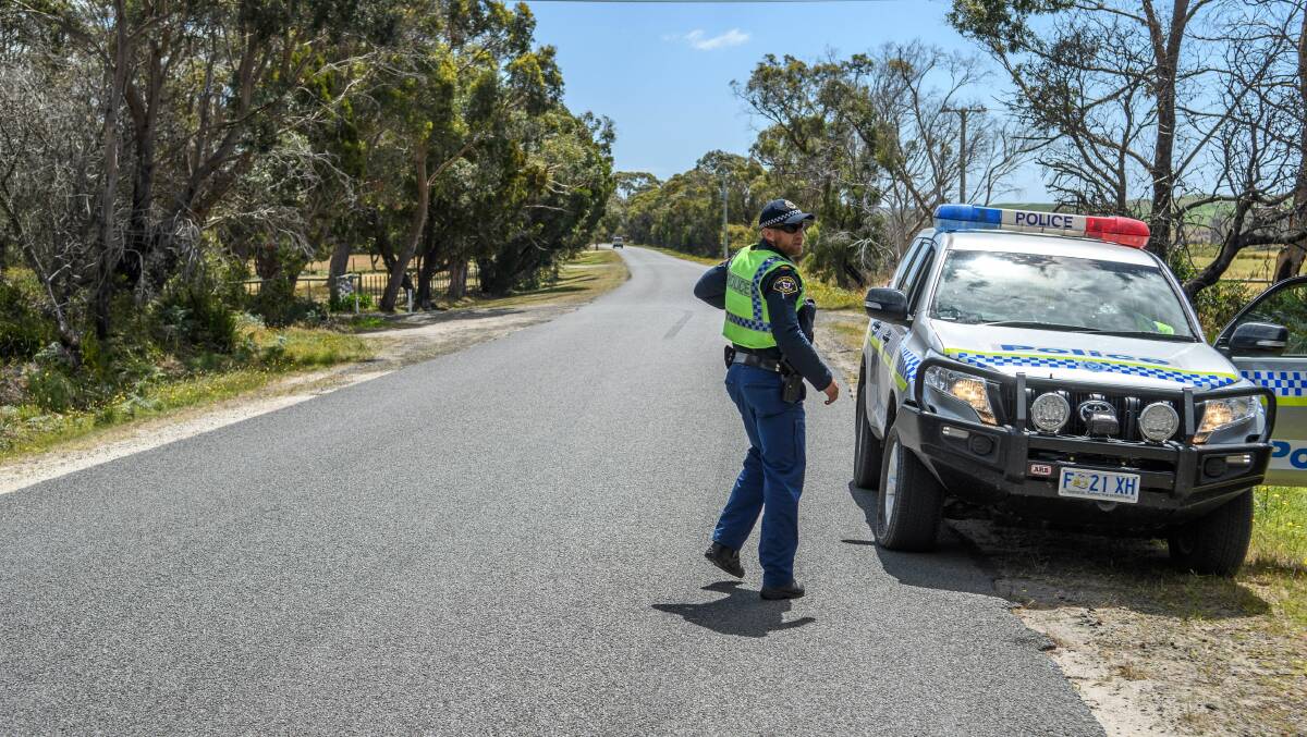 Tasmania Police on Sandy Points Road at Bridport, on Sunday afternoon. Picture: Scott Gelston