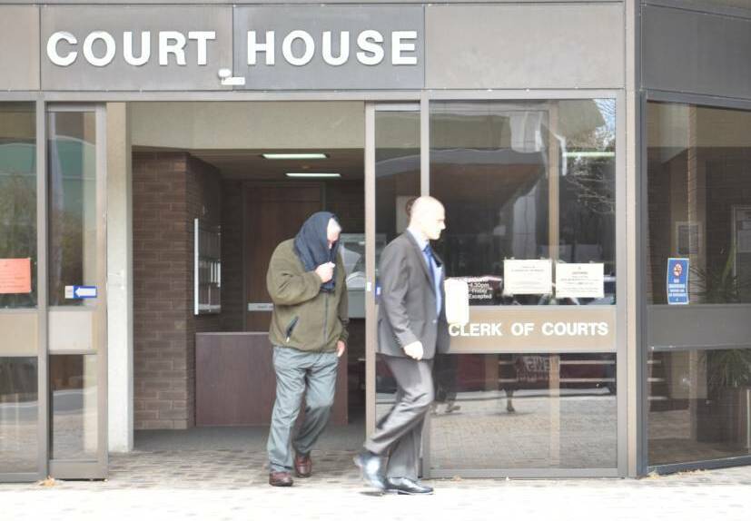 Clive William Black leaves court with his lawyer following an earlier appearance. Photo: Ivy James.