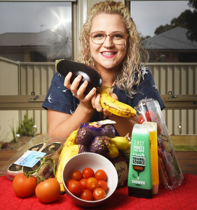 Beautiful waste: Tara Anderson shows off some of the produce and goods she's saved from Ballarat supermarket 'dumpsters'. Picture: Luka Kazlauric.