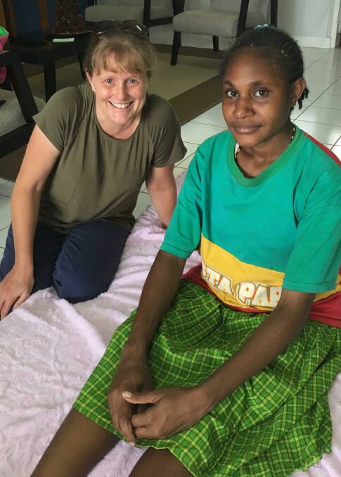 Bunbury midwife Fiona Webb with Mama Uli, 17, in West Papua. 