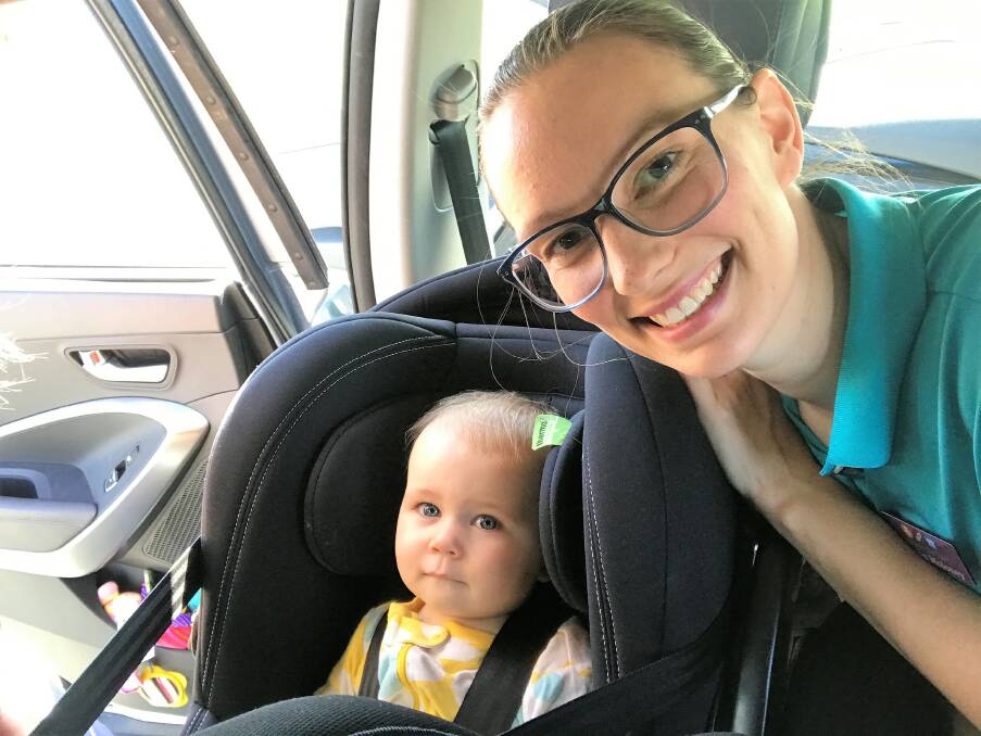 Car seat safety mission: Lauren Moloney with her youngest daughter Elsie Joy, 10 months old, in her rear-facing car seat. Picture: Emily Sharp. 