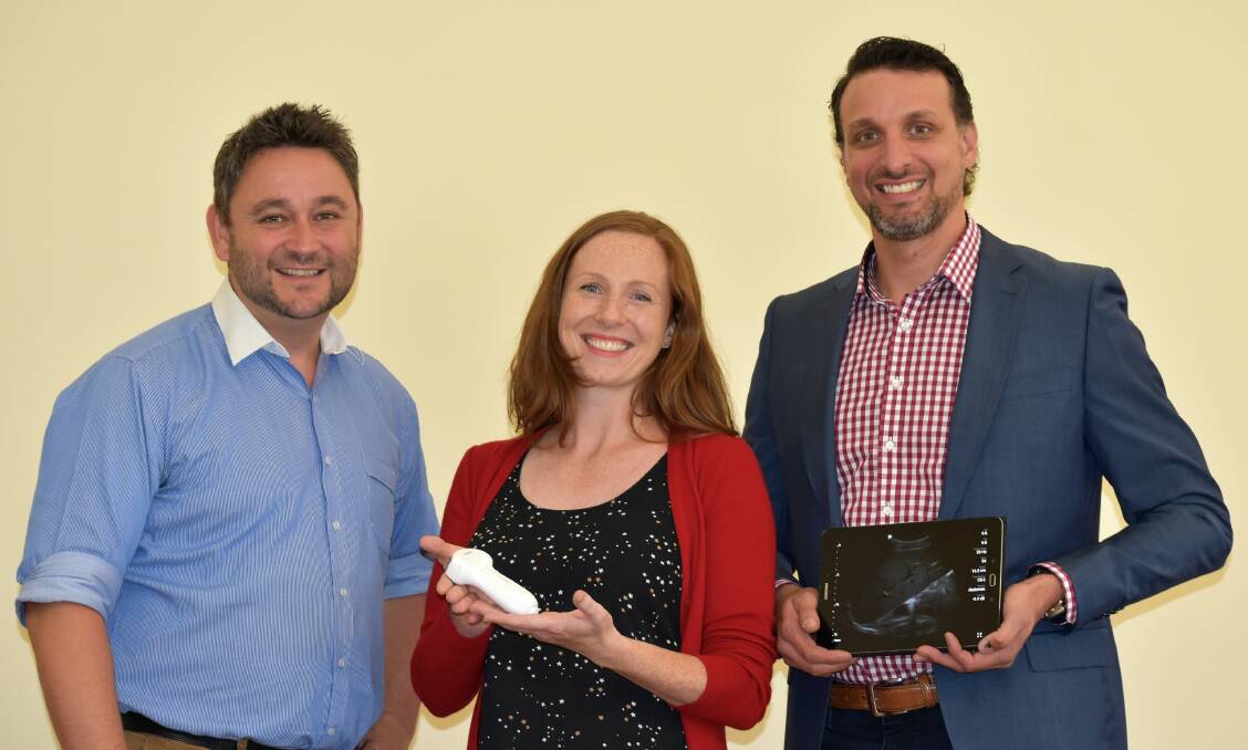Specialist Obstetrician Gynaecologists Ben Cunningham and Stephanie Green with Philips clinical specialist Stephen Cipriani with the portable ultrasound device.