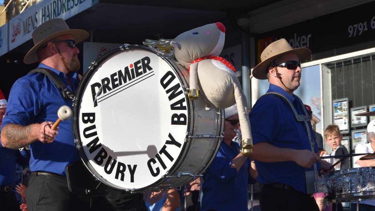 Thousands gathered on the streets as community groups, emergency services, cartoon characters and performers brought Christmas cheer to the streets of Bunbury's CBD. 