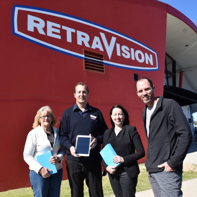 Bunbury Retravision's Brian Fraser hands over three Samsung tablets to South West Group's Denise Mercer. Pictured here also Australia's South West CEO Catrin Allsop and Dean Lomax. Photo: Ivy James