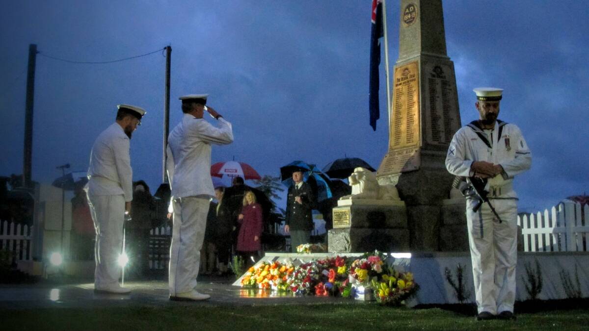 1200 people gathered in a pre-dawn rain to honour more than the Anzac spirit at the town's restored war memorial. Photo: Jem Hedley