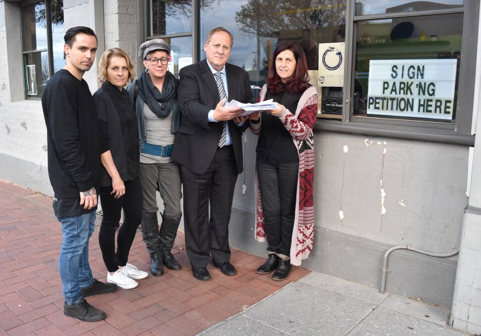 The Townhouse owner Craig Lyons, Sabotage owner Megan Gianfrancesco, Bunbury Hi-Fi owner Cheryl Kozisek, Member for Bunbury Don Punch and Mojos owner Juliana Frisina with their petition which currently has over 2000 signatures, and counting.
