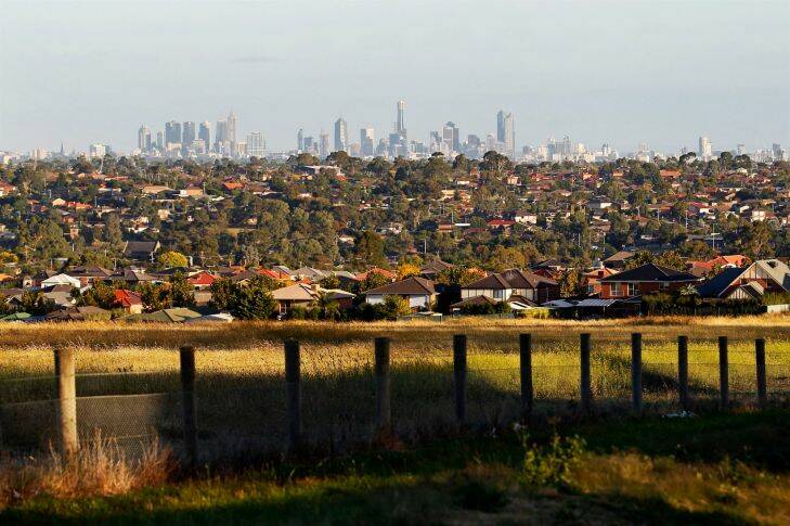 View of the Melbourne city skyline from Mickleham Road in Greenvale. Generic urban sprawl, urban development, new housing estate, outer suburbs, housing developments, urban fringe, rooftops, green wedge, rural fringe, city planning, commuter suburbs. Picture by PAUL ROVERE / THE AGE. 31 March 2011. NEWS