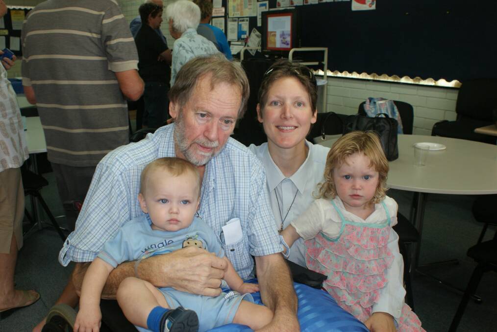 Dedicated: Students, teachers, family and community attended a special assembly held in Phill Farley s honour to celebrate his 40-year contribution to Central Midlands Senior High School. Pictured is Mr Farley with his wife Juanita and two children Daniel,1, and Rachael, 2.