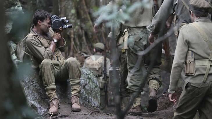 On a mission: Damien Parer (Matt Le Nevez) films Australian troops as they advance through the muck.