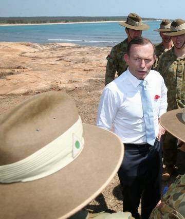 Prime Minister Tony Abbott meets with soldiers in North East Arnhem Land on Thursday. Photo: Alex Ellinghausen