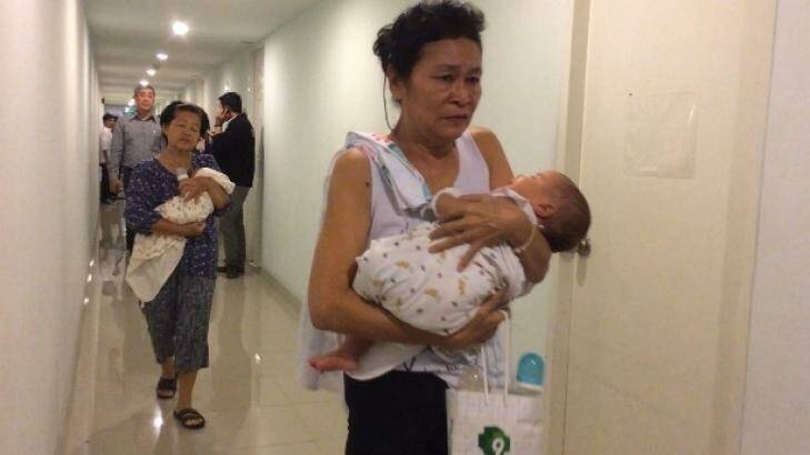 Officials conduct a raid on a surrogacy agency in Thailand. Photo: Thai Rath TV