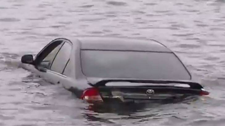 A car has plunged into the Swan River just off Mounts Bay Road in Crawley. Photo: 7 News Perth