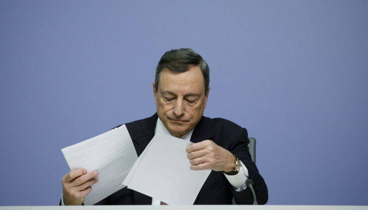 Mario Draghi, president of the European Central Bank (ECB), arranges documents during a news conference following the bank's interest rate decision, at the ECB headquarters in Frankfurt, Germany, on Thursday, Dec. 14, 2017. The European Central Bank maintained its pledge to move slowly in winding down euro-area stimulus, as investors wait to see if President Mario Draghi will unveil a more upbeat economic outlook. Photographer: Alex Kraus/Bloomberg