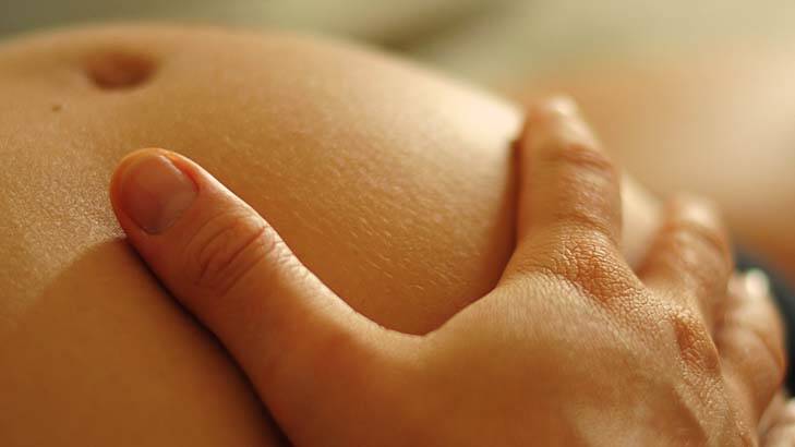 A caring touch: relaxing can help relieve pain during childbirth. Photo: Douglas Baker