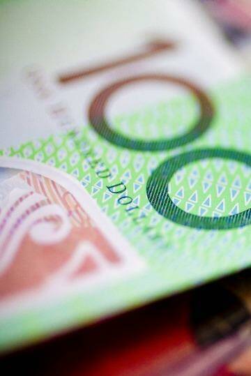 Global factors are likely to keep the Australian dollar under pressure.  Photo: Glenn Hunt