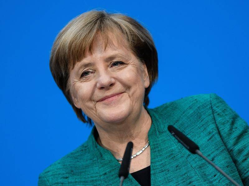 German Chancellor Angela Merkel has agreed to major compromises to form a new government.