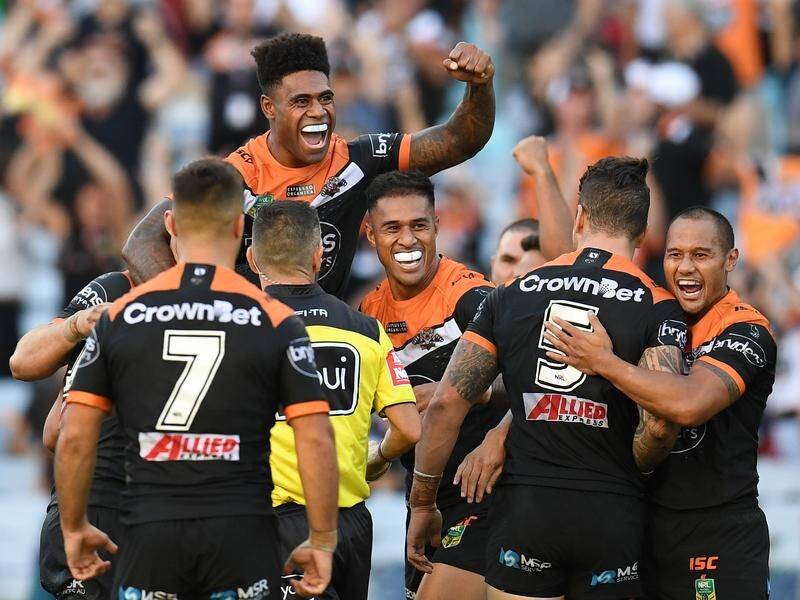 A 79th-minute conversion has given the Wests Tigers a dramatic 10-8 win over the Sydney Roosters.
