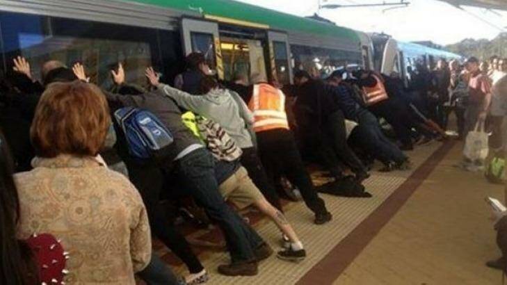 Passengers famously helped rock a train carriage in Perth Station to free a man trapped in the gap in 2014. Photo: Renae Bryant/Facebook