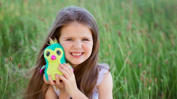 Canberra's Maisy Ellis was lucky enough to receive a Hatchimal for her seventh birthday two weeks ago.  Photo: Melissa Ellis